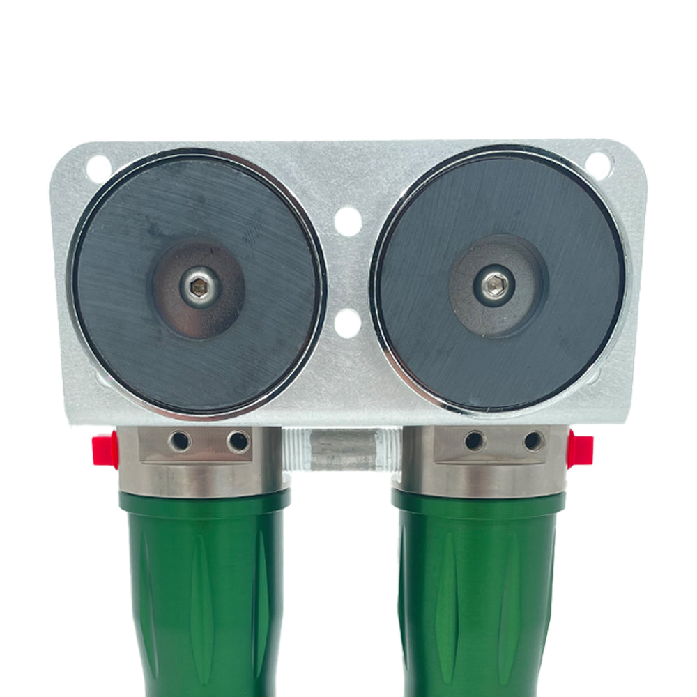two circular magnets attached to a bracket with green purifiers attached to it